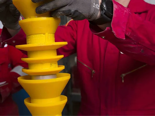 Worker measuring cementing plug